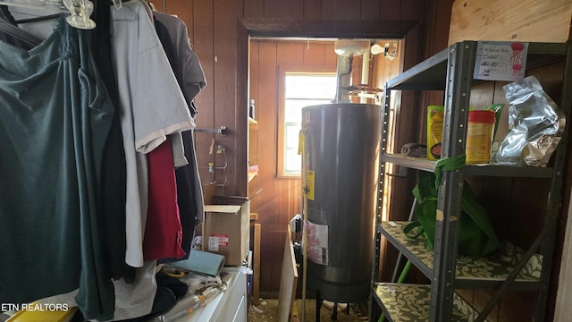 utility room with water heater