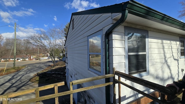 view of side of property with fence