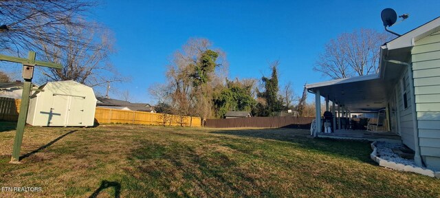 107 W Pawley Rd, Oak Ridge, TN 37830 - view of yard featuring a fenced backyard, an outbuilding, and a storage shed