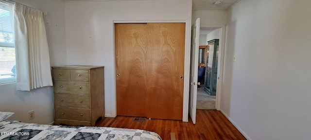 107 W Pawley Rd, Oak Ridge, TN 37830 - bedroom with multiple windows, wood finished floors, and a closet