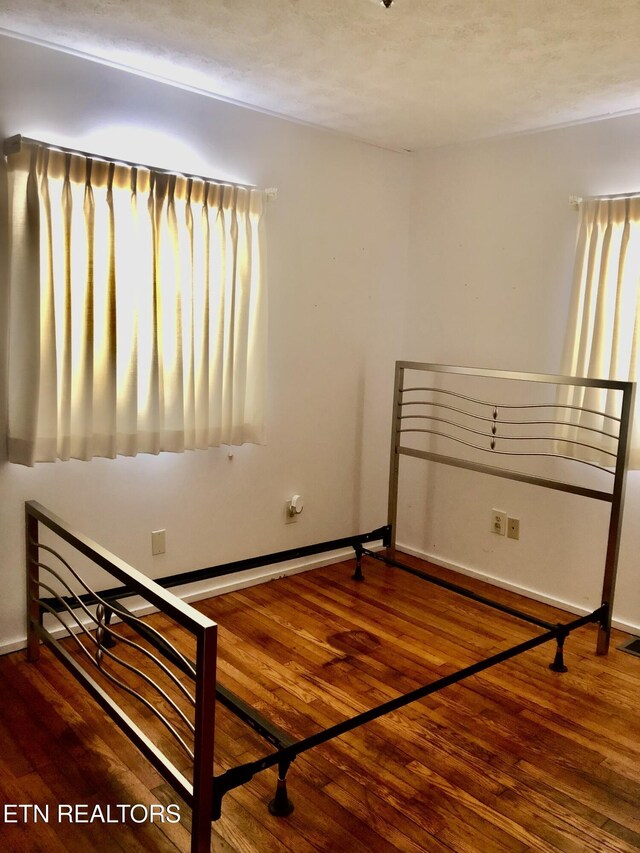 107 W Pawley Rd, Oak Ridge, TN 37830 - bedroom with baseboards and wood finished floors