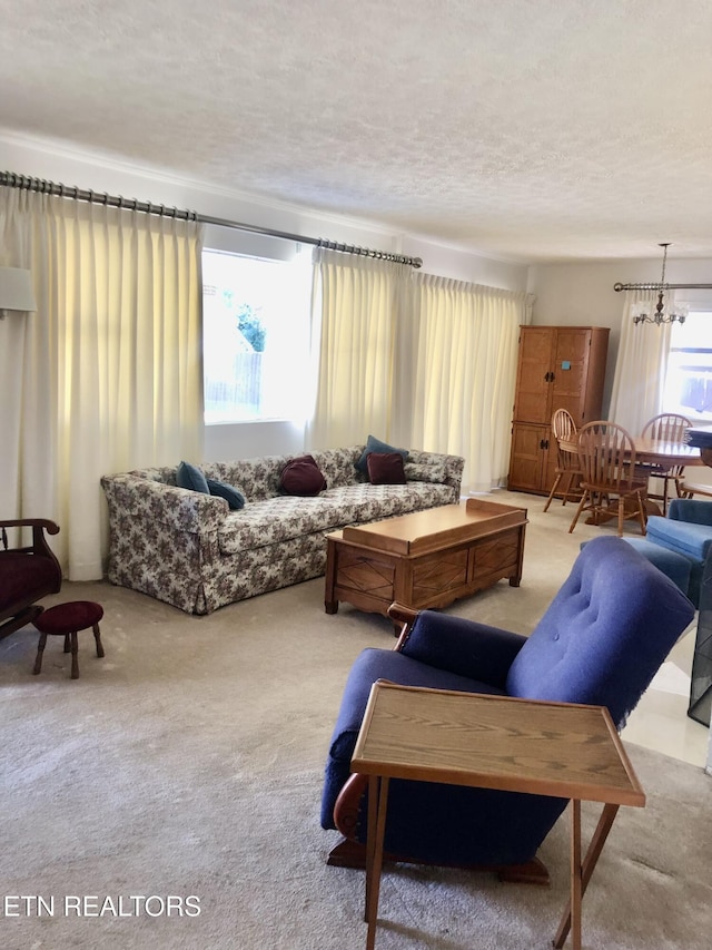 107 W Pawley Rd, Oak Ridge, TN 37830 - living area featuring an inviting chandelier, carpet flooring, and a textured ceiling