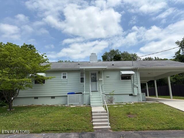 107 W Pawley Rd, Oak Ridge, TN 37830 - ranch-style house featuring a front lawn, an attached carport, crawl space, a chimney, and driveway