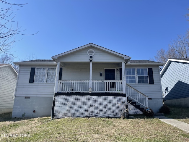 view of front facade with crawl space, a porch, and a front yard