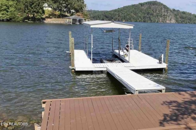 view of dock featuring a water view