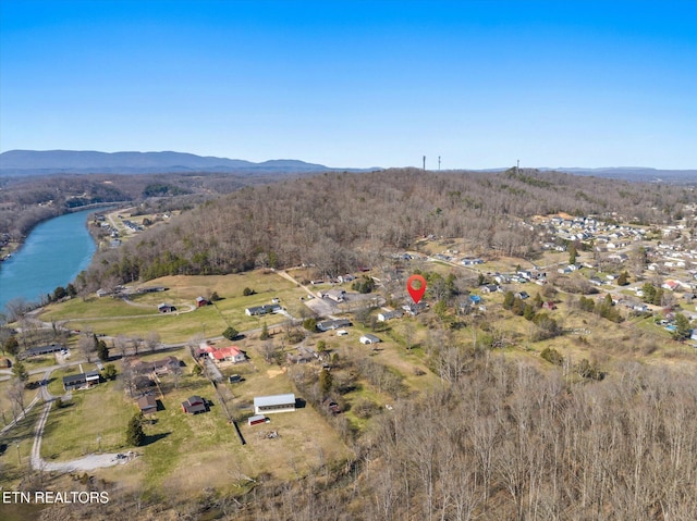 drone / aerial view with a water and mountain view