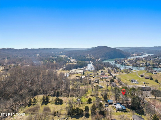 bird's eye view with a water and mountain view