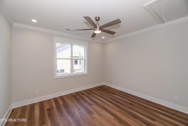 unfurnished room featuring ornamental molding, dark wood finished floors, recessed lighting, baseboards, and attic access