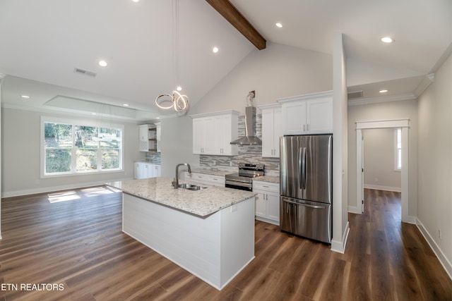 kitchen featuring appliances with stainless steel finishes, white cabinetry, wall chimney range hood, and a sink