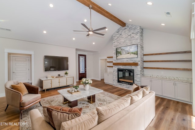 405 Awohili Trce, Loudon, TN 37774 - living area featuring beamed ceiling, a fireplace, visible vents, and light wood finished floors