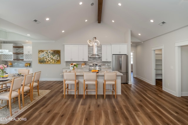 405 Awohili Trce, Loudon, TN 37774 - kitchen featuring visible vents, wall chimney range hood, a center island with sink, appliances with stainless steel finishes, and white cabinetry
