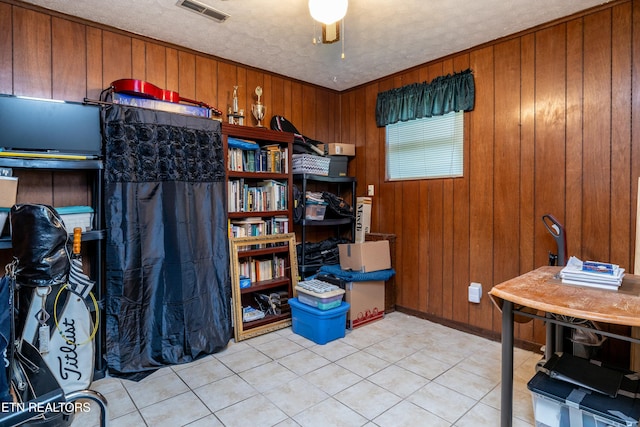 storage area featuring visible vents and ceiling fan