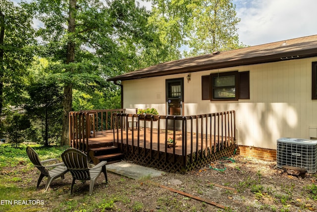 exterior space with a wooden deck and central AC