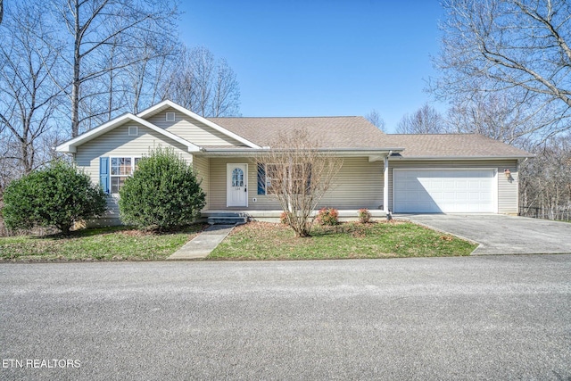 ranch-style house with concrete driveway, a garage, and a shingled roof