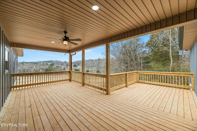 wooden deck with a ceiling fan