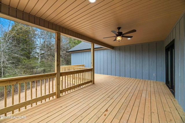 wooden deck featuring a ceiling fan