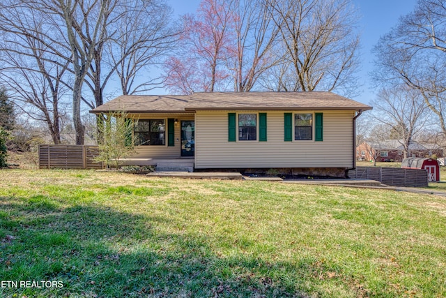 view of front of house featuring a front yard and fence