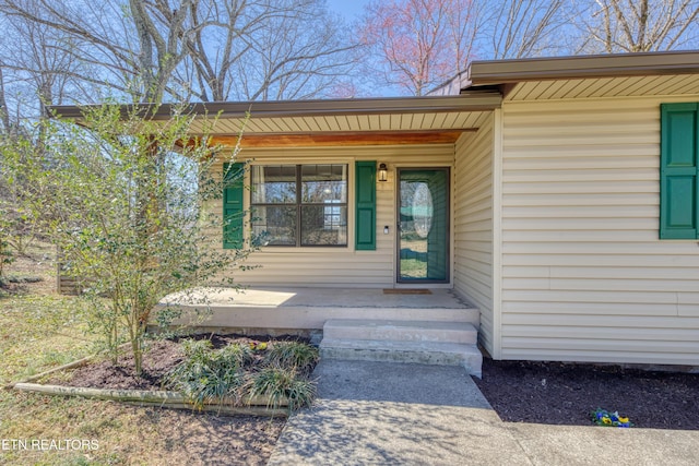 entrance to property with a porch