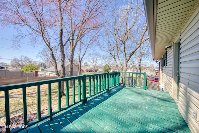 wooden terrace featuring fence