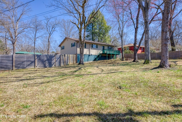 view of yard with fence and a wooden deck