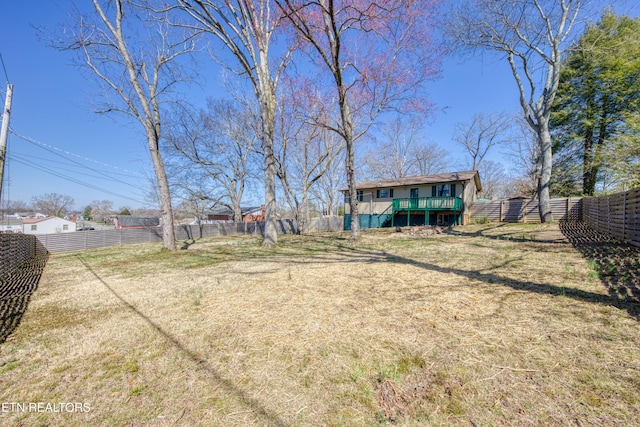 view of yard featuring a deck and a fenced backyard