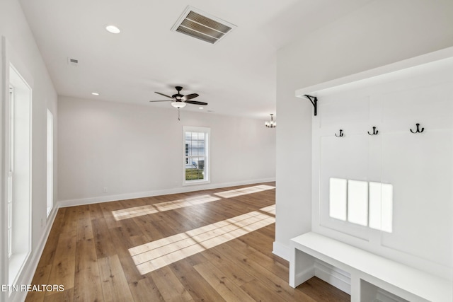 mudroom featuring hardwood / wood-style floors, recessed lighting, visible vents, and baseboards