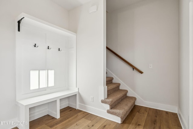 mudroom featuring baseboards and hardwood / wood-style floors