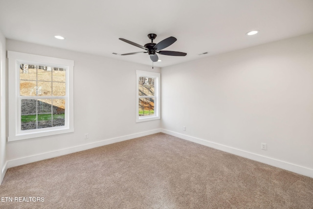 spare room with recessed lighting, visible vents, baseboards, and carpet flooring