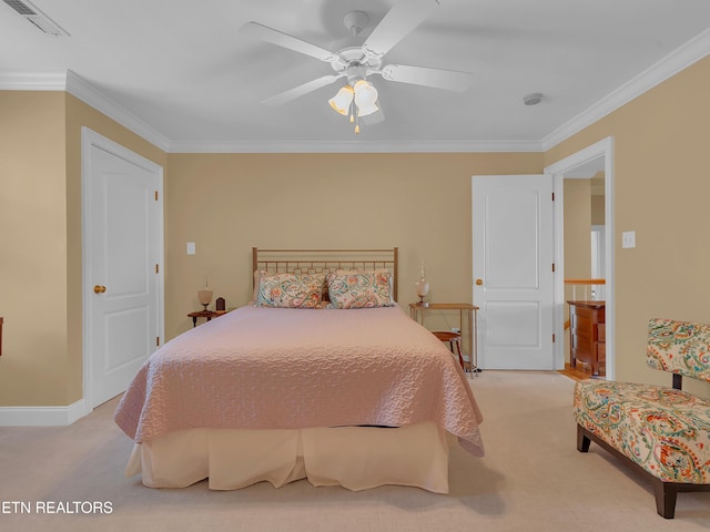 carpeted bedroom featuring ceiling fan, baseboards, visible vents, and ornamental molding