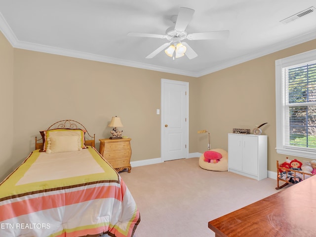 carpeted bedroom featuring visible vents, ceiling fan, baseboards, and ornamental molding