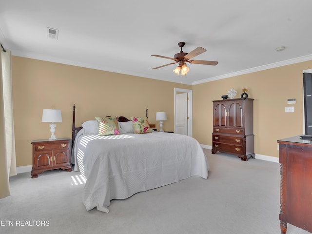 bedroom featuring visible vents, light colored carpet, and ornamental molding