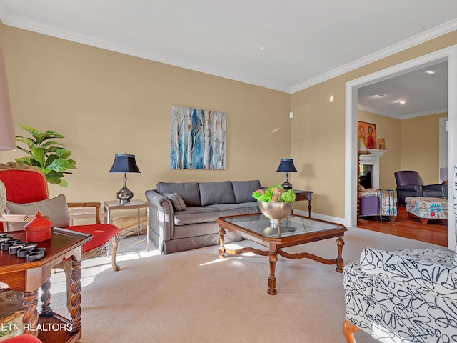 living area featuring baseboards, carpet floors, a fireplace, and crown molding