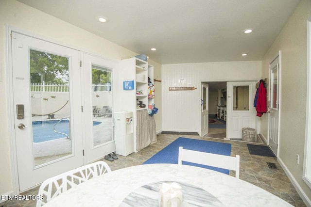 bathroom featuring recessed lighting, visible vents, baseboards, and stone finish floor