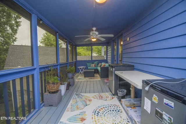 sunroom / solarium with ceiling fan