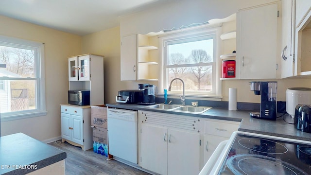 kitchen featuring a sink, open shelves, white cabinets, black microwave, and white dishwasher