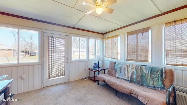 sunroom / solarium with a wealth of natural light and ceiling fan