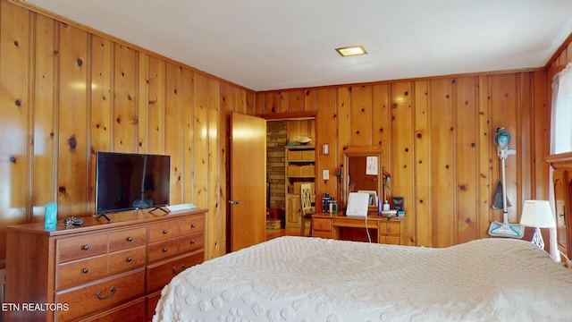 bedroom with wooden walls