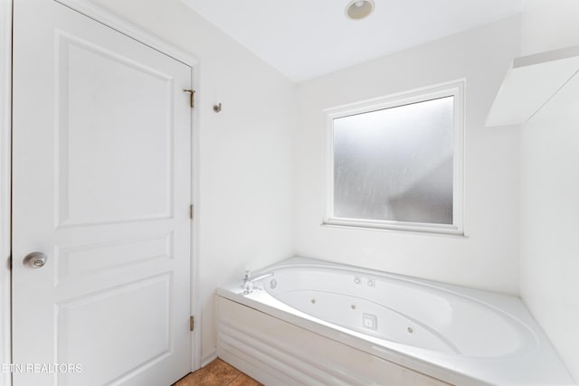 bathroom featuring a tub with jets