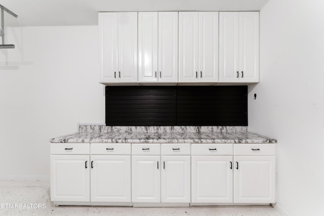 room details with baseboards and speckled floor