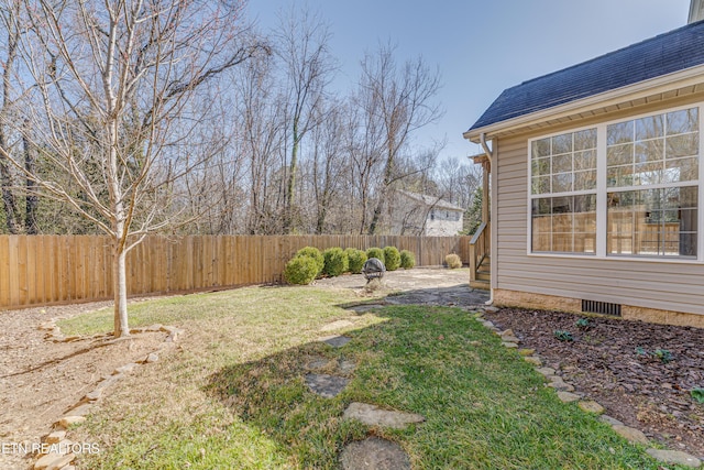 view of yard with a patio area and a fenced backyard