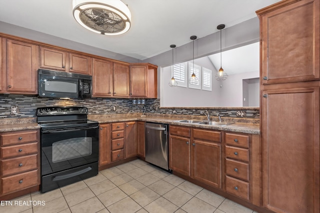 kitchen featuring decorative backsplash, black appliances, and a sink