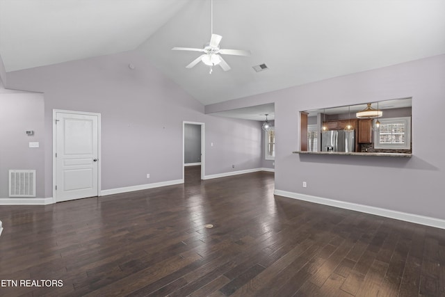 unfurnished living room featuring dark wood-type flooring, baseboards, visible vents, and ceiling fan
