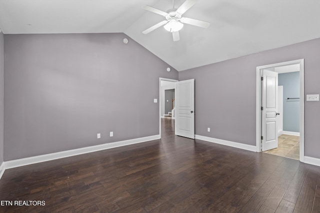 unfurnished bedroom with baseboards, lofted ceiling, a ceiling fan, and hardwood / wood-style flooring