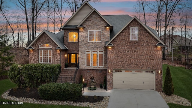 view of front of property with concrete driveway, a garage, and brick siding