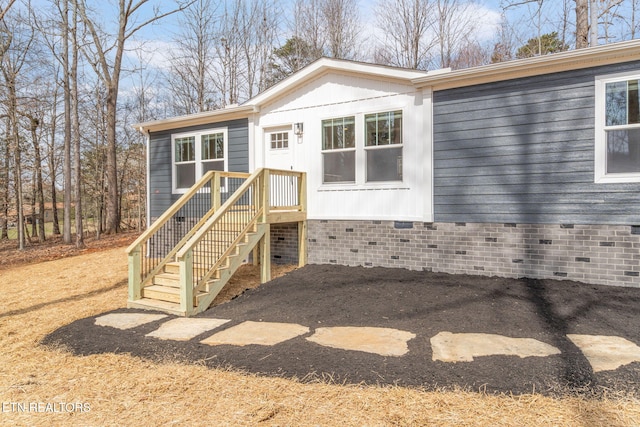 view of front of house featuring crawl space