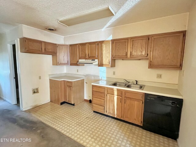 kitchen with a sink, range hood, brown cabinetry, light floors, and dishwasher