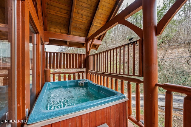 deck featuring a hot tub