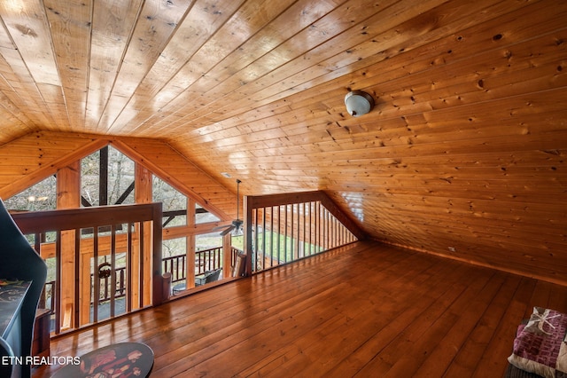 bonus room with wood ceiling, hardwood / wood-style floors, wood walls, and vaulted ceiling