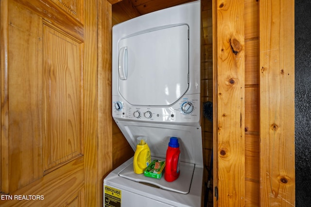 washroom featuring laundry area and stacked washer and clothes dryer