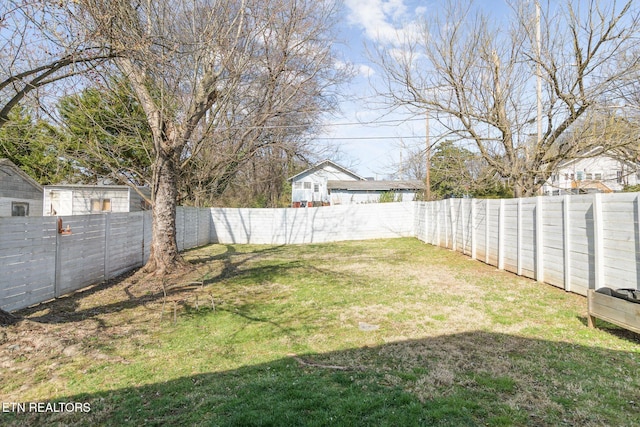 view of yard with a fenced backyard